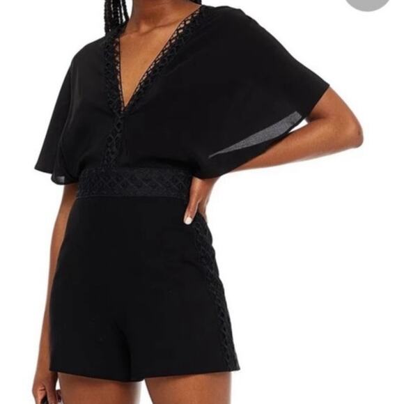Maje Idelle Lace Trim Flutter Sleeve V Neck Silk Romper in Noir XS